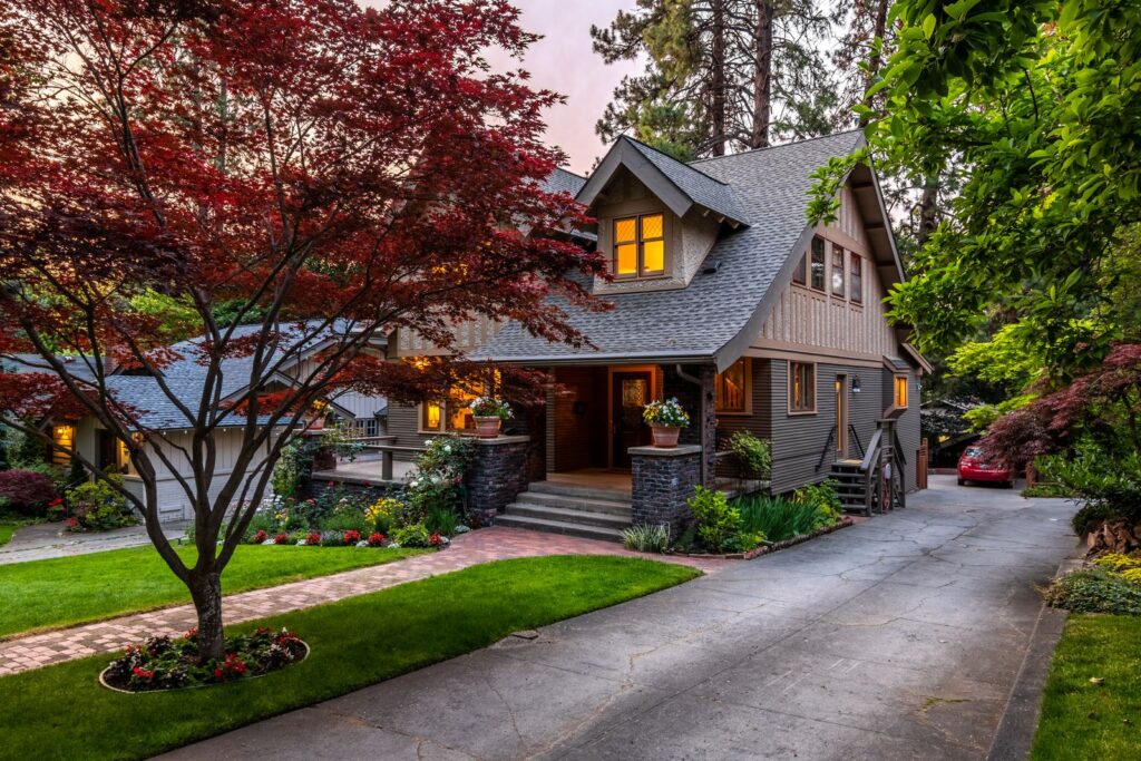 Established home with mature trees at dusk